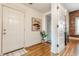 Bright hallway showcases hardwood floors, white doors, and a glimpse of the kitchen at 643 Fort Wayne Ave # H, Indianapolis, IN 46204