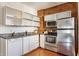 Modern kitchen with stainless steel appliances, granite countertops, and ample cabinet space at 643 Fort Wayne Ave # H, Indianapolis, IN 46204