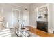 Comfortable living room area with hardwood floors, custom built-ins, and neutral color palette at 643 Fort Wayne Ave # H, Indianapolis, IN 46204