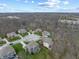 Beautiful neighborhood with well-maintained homes surrounded by lush trees and a tranquil lake at 6711 Colville Pl, Indianapolis, IN 46236