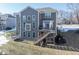 House exterior showcasing a deck, backyard, and trampoline at 6711 Colville Pl, Indianapolis, IN 46236