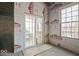 Unfinished basement with sliding glass door leading outside at 6711 Colville Pl, Indianapolis, IN 46236