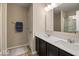 Bathroom boasts double vanity with a large mirror and shower at 6711 Colville Pl, Indianapolis, IN 46236