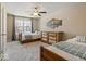 Bedroom with two twin beds, ceiling fan and access to loft at 6711 Colville Pl, Indianapolis, IN 46236