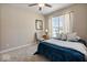 Bright bedroom with large window and ceiling fan at 6711 Colville Pl, Indianapolis, IN 46236