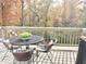 Deck with patio table and chairs, overlooking wooded area at 6711 Colville Pl, Indianapolis, IN 46236