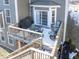 Elevated deck with stairs, seating, and grill at 6711 Colville Pl, Indianapolis, IN 46236