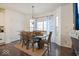 Charming dining area with wooden table and window seating at 6711 Colville Pl, Indianapolis, IN 46236