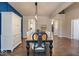 Elegant dining room with a large table and blue accent wall at 6711 Colville Pl, Indianapolis, IN 46236