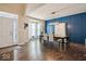 Formal dining room with hardwood floors and blue accent wall at 6711 Colville Pl, Indianapolis, IN 46236
