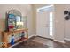 Inviting entryway with decorative console table and mirror at 6711 Colville Pl, Indianapolis, IN 46236