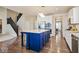 Kitchen island with blue cabinets and hardwood floor at 6711 Colville Pl, Indianapolis, IN 46236