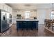 Spacious kitchen with island, stainless steel appliances, and hardwood floors at 6711 Colville Pl, Indianapolis, IN 46236