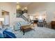 Open living room with two-story ceilings and cozy seating at 6711 Colville Pl, Indianapolis, IN 46236