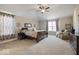 Spacious main bedroom with large windows and ceiling fan at 6711 Colville Pl, Indianapolis, IN 46236
