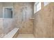 Walk-in shower with built-in seat and tiled walls at 6711 Colville Pl, Indianapolis, IN 46236