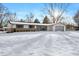 Ranch home with attached garage, snow covered yard at 6731 W 15Th St, Indianapolis, IN 46214