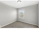 Bright bedroom with window and neutral walls at 8103 Grove Berry Way, Indianapolis, IN 46239