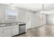 Modern kitchen with stainless steel appliances and hardwood floors at 8103 Grove Berry Way, Indianapolis, IN 46239