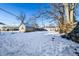 Snowy backyard with shed and wooden fence at 857 S Tompkins St, Shelbyville, IN 46176