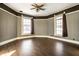 Bedroom with wood floors and wood wall paneling at 857 S Tompkins St, Shelbyville, IN 46176