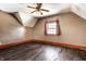 Empty bedroom with hardwood floors, ceiling fan, and window with curtains at 857 S Tompkins St, Shelbyville, IN 46176