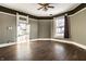 Another view of the living room with wood floors and paneling at 857 S Tompkins St, Shelbyville, IN 46176