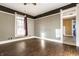 Living room with wood floors and wood wall paneling at 857 S Tompkins St, Shelbyville, IN 46176