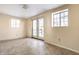 Empty spare room with new flooring, fresh paint and access to backyard at 857 S Tompkins St, Shelbyville, IN 46176