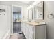 Bathroom boasts double sinks, granite countertop, and large mirrors at 8810 W Tulip Tree Dr, Muncie, IN 47304
