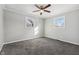 Bright bedroom with carpet, ceiling fan and two windows at 8810 W Tulip Tree Dr, Muncie, IN 47304