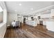Modern kitchen with white cabinets, island, and stainless steel appliances at 8810 W Tulip Tree Dr, Muncie, IN 47304