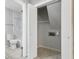 Convenient laundry room with built-in shelving and access to stairs at 8810 W Tulip Tree Dr, Muncie, IN 47304