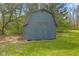 A backyard shed featuring a gable roof, side entry, and painted siding at 8810 W Tulip Tree Dr, Muncie, IN 47304