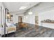 Spacious sunroom featuring hardwood floors, a chandelier, and views of the backyard at 8810 W Tulip Tree Dr, Muncie, IN 47304