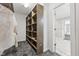 Spacious walk-in closet with built-in shelves and hanging rods at 8810 W Tulip Tree Dr, Muncie, IN 47304