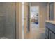 Open bathroom with a glass shower, toilet, and views of the Primary bedroom at 1001 Parker Ln, Westfield, IN 46074