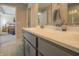 Bright bathroom with a gray vanity, white countertops, and access to the bedroom at 1001 Parker Ln, Westfield, IN 46074