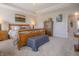 Inviting bedroom featuring wood furnishings, soft lighting, and neutral decor at 1001 Parker Ln, Westfield, IN 46074