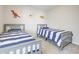 Bright, cheery bedroom with two beds, carpet and fun decor at 1001 Parker Ln, Westfield, IN 46074