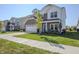 Charming two-story home with a well-kept lawn and paved driveway at 1001 Parker Ln, Westfield, IN 46074