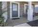 Inviting front porch with gray front door and a welcome mat at 1001 Parker Ln, Westfield, IN 46074