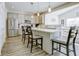 Modern kitchen featuring stainless steel appliances, a large island, and seamless access to the dining area at 1001 Parker Ln, Westfield, IN 46074