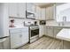 Beautifully designed kitchen equipped with stainless steel appliances, modern cabinetry, and durable countertops at 1001 Parker Ln, Westfield, IN 46074