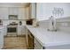 Well-equipped kitchen boasting quartz countertops, stainless steel appliances, and stylish gray cabinetry at 1001 Parker Ln, Westfield, IN 46074
