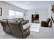 Relaxing living room featuring reclining sofa, neutral tones, and ample natural light at 1001 Parker Ln, Westfield, IN 46074