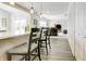 Bright open-concept living room features modern flooring, bar seating, and neutral decor at 1001 Parker Ln, Westfield, IN 46074