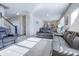 Comfortable living room showcasing plush leather seating and an open layout, bathed in natural light at 1001 Parker Ln, Westfield, IN 46074