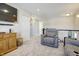 Cozy living room with plush seating, neutral carpet, and stylish lighting at 1001 Parker Ln, Westfield, IN 46074