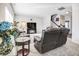Cozy living room with a TV, staircase, and comfortable seating, perfect for relaxing and entertaining guests at 1001 Parker Ln, Westfield, IN 46074